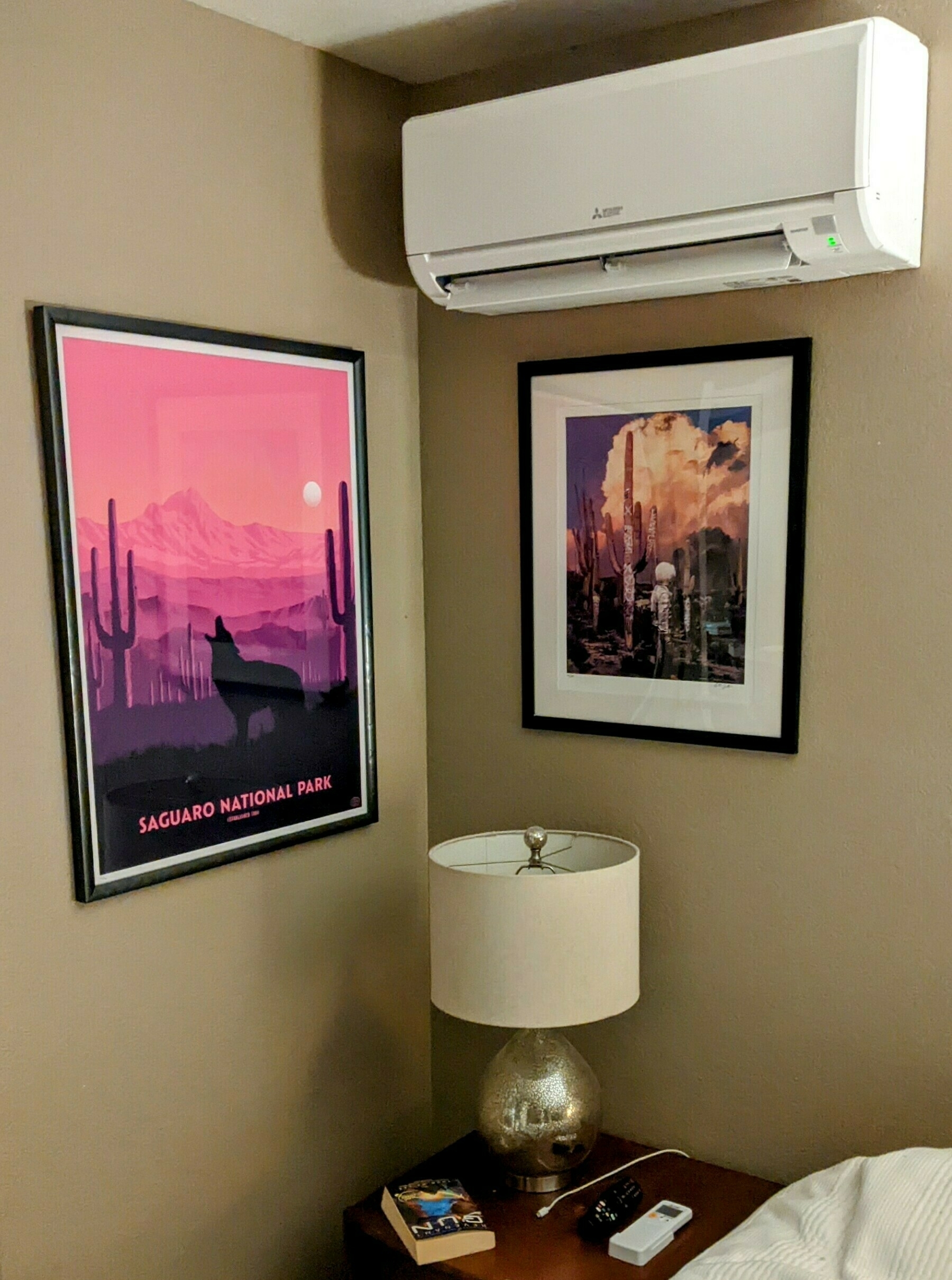 Heat pump head in bedroom with two saguaro art prints 